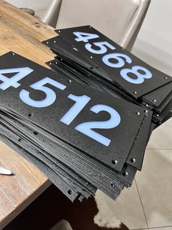 Batch of replacement number panels on workbench